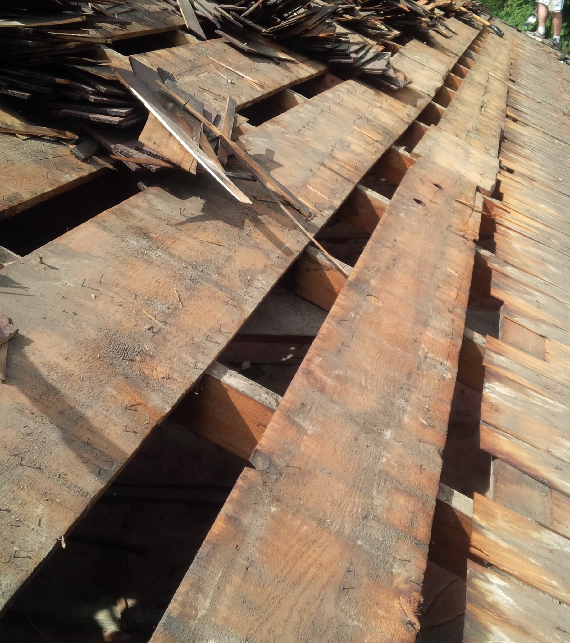 wood shake tear off reveals gaps in roof deck